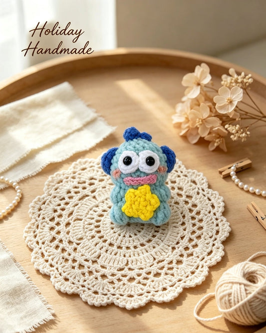 Handmade crochet blue fish with yellow star belly in a cozy holiday scene