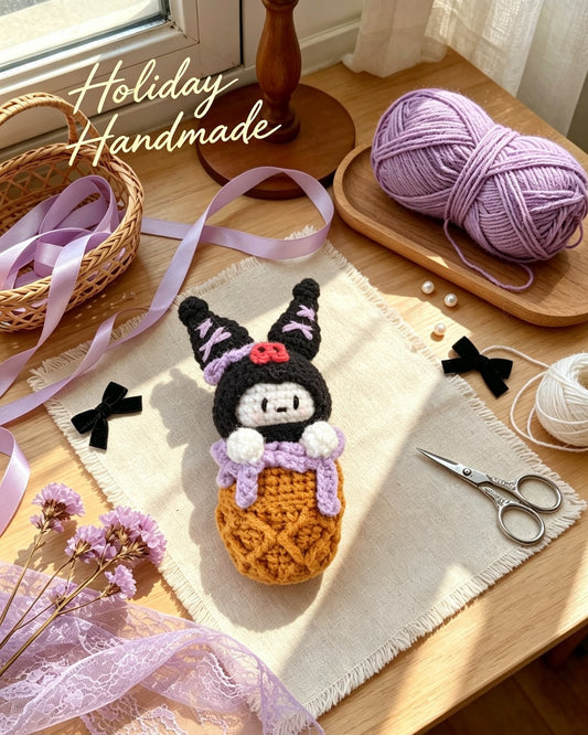 Handmade crochet black bunny in a waffle cone keychain, styled scene